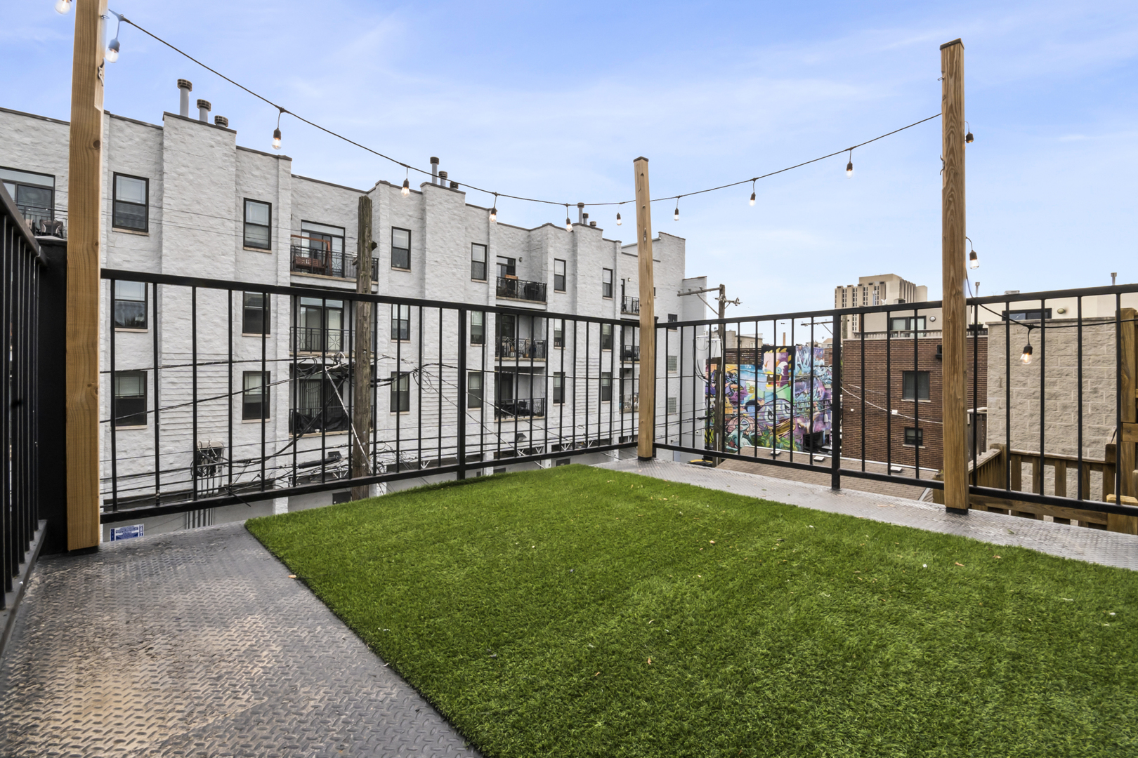 2035 West Crystal Street, Unit 3 Chicago, IL 60622 - Photo 11 of 18 a view of a deck with a big yard
