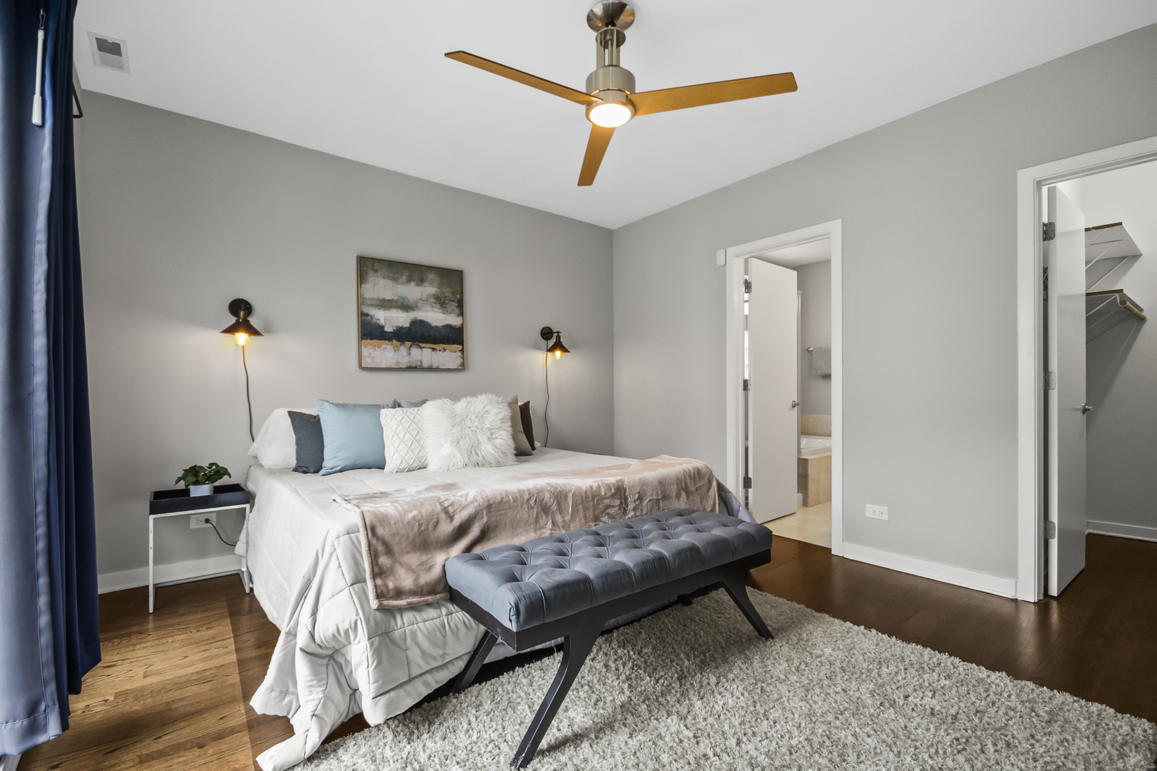 2035 West Crystal Street, Unit 3 Chicago, IL 60622 - Photo 13 of 18 a bedroom with a bed a dresser and wooden floor