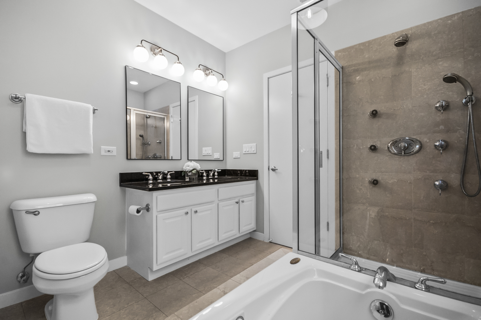 2035 West Crystal Street, Unit 3 Chicago, IL 60622 - Photo 15 of 18 a bathroom with a granite countertop sink toilet and shower