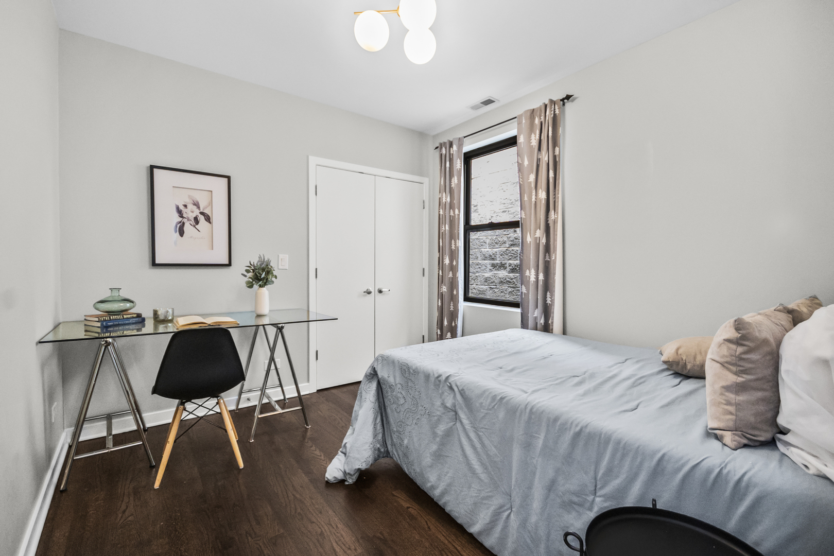 2035 West Crystal Street, Unit 3 Chicago, IL 60622 - Photo 16 of 18 a bedroom with a bed and a chandelier