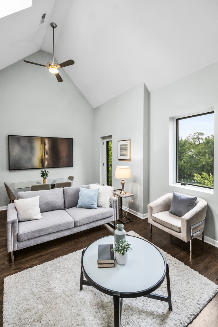 2035 West Crystal Street, Unit 3 Chicago, IL 60622 - Photo 3 of 18 a living room with furniture and a table