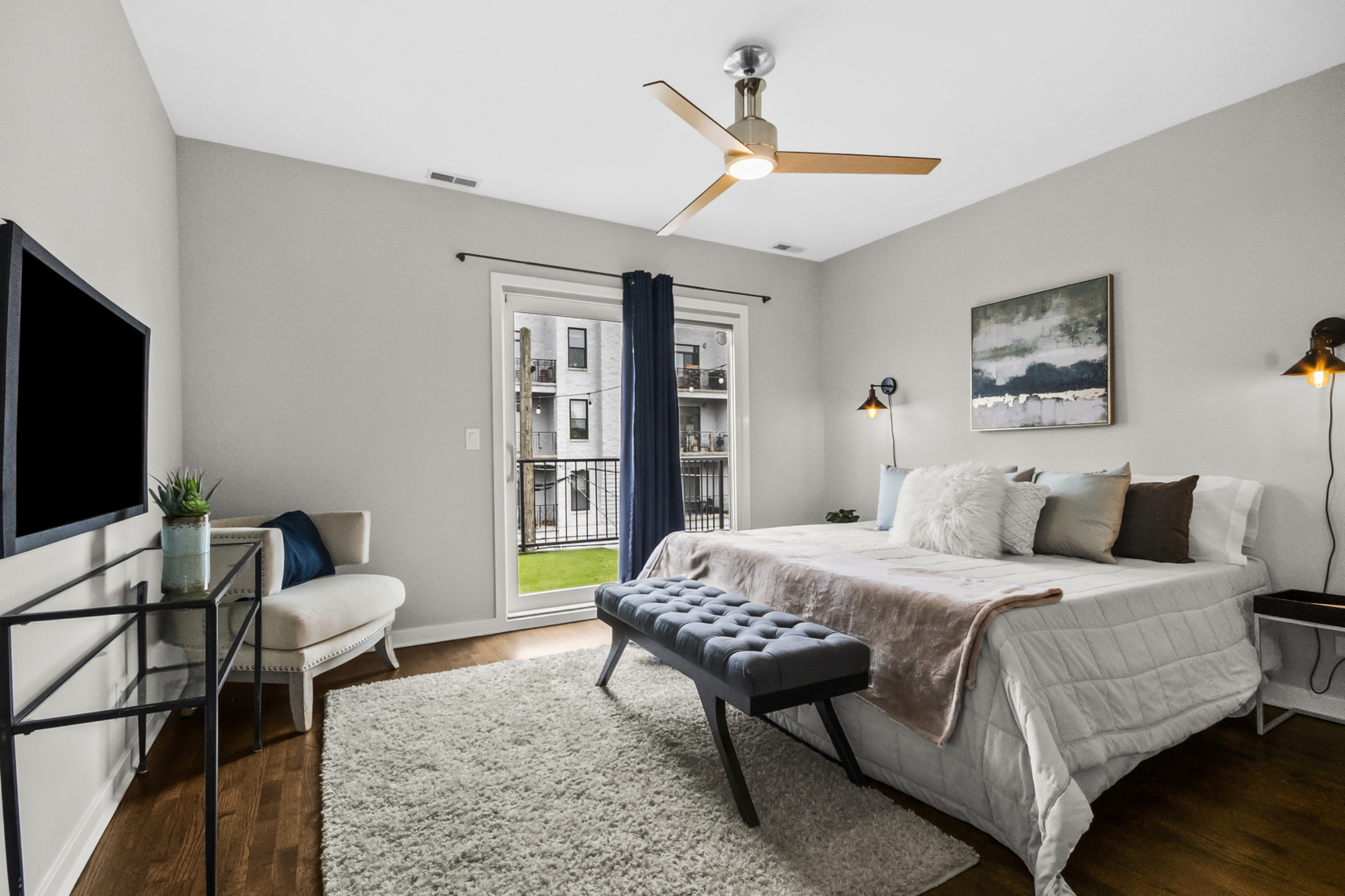 2035 West Crystal Street, Unit 3 Chicago, IL 60622 - Photo 10 of 18 a bedroom with a bed and a flat screen tv