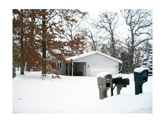 391 Westmore Road Davis, IL 61019 - Photo 1 of 6 a wooden bench sitting in front of house