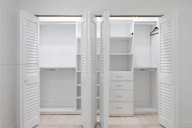 a view of an empty walk in closet