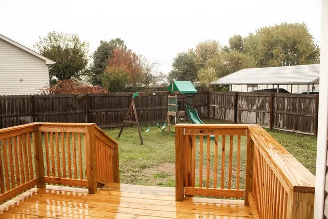 a view of a backyard with a tub and wooden floor
