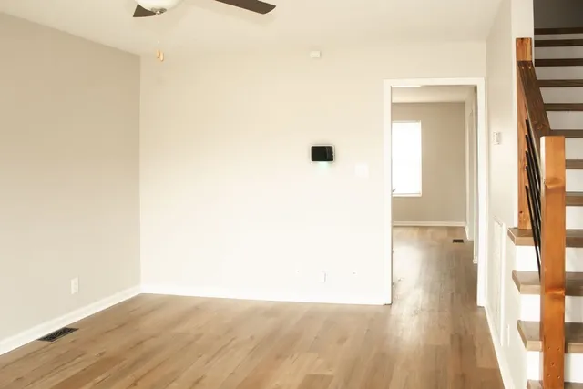 a view of a bathroom with wooden floor