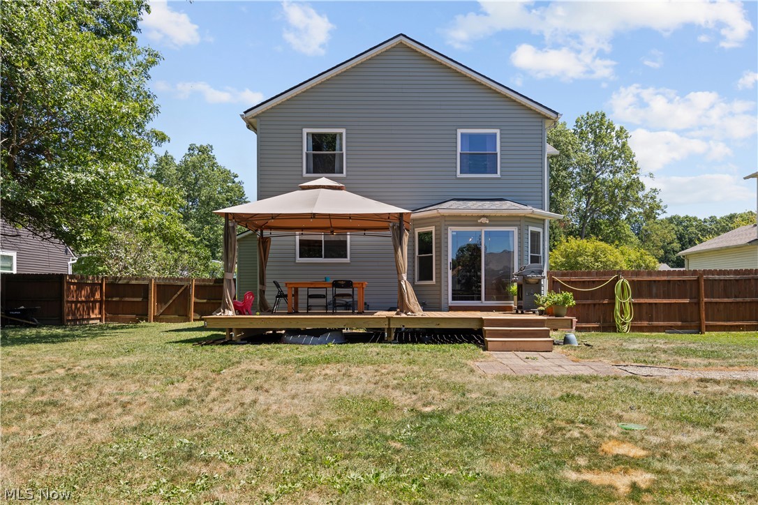 684 Guilford Road Vermilion, OH 44089 - Photo 34 of 37 Back of house with a deck, a gazebo, and a yard