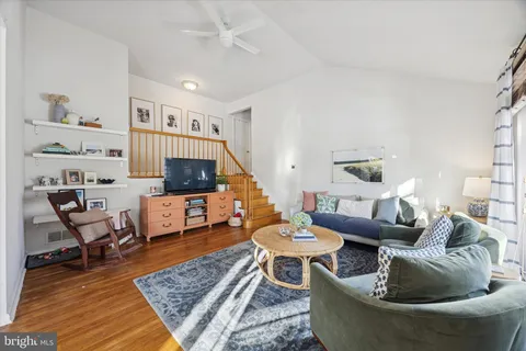 a living room with furniture and a rug
