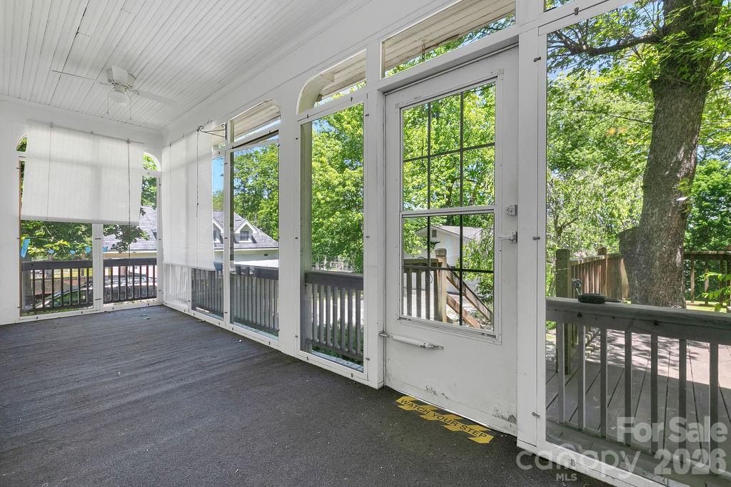 208 West Probart Street Brevard, NC 28712 - Photo 42 of 48 a view of a porch with wooden floor and outdoor space