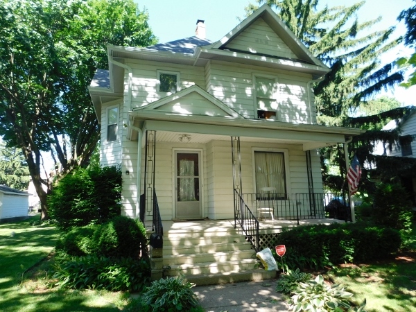 714 North Main Street Rochelle, IL 61068 - Photo 1 of 15 front view of a house with a yard