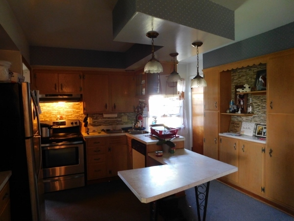 714 North Main Street Rochelle, IL 61068 - Photo 3 of 15 a kitchen with refrigerator and cabinets