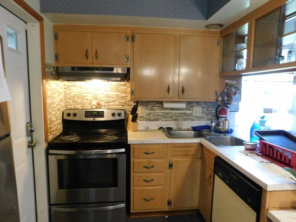 714 North Main Street Rochelle, IL 61068 - Photo 5 of 15 a kitchen with a stove and a sink