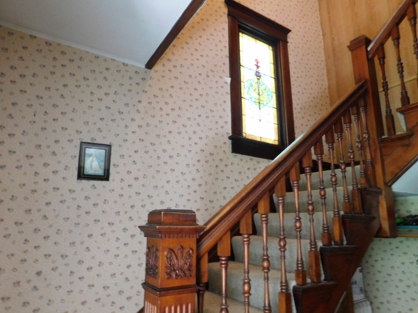 714 North Main Street Rochelle, IL 61068 - Photo 8 of 15 a view of entryway with wooden floor and stairs