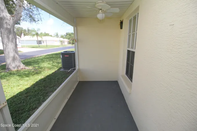 a view of balcony and yard