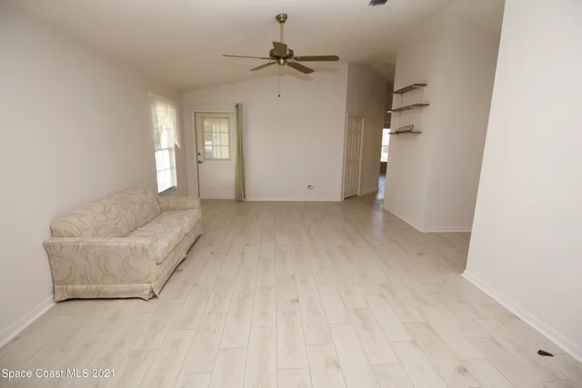 a view of an empty room with a window