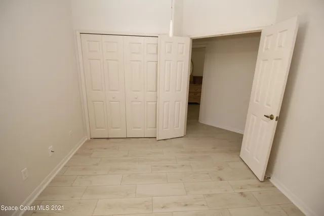 an empty room with a wooden door