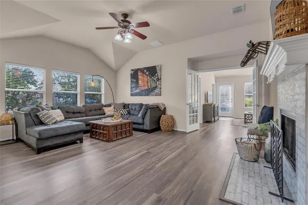 a living room with furniture and a fireplace