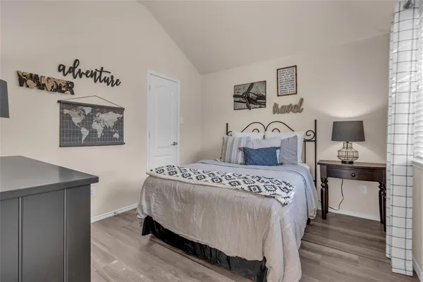 a bedroom with a bed and window