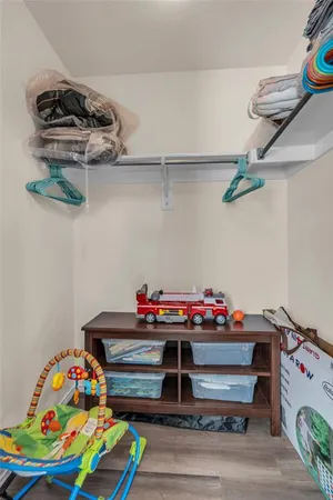 a room with toys and dresser