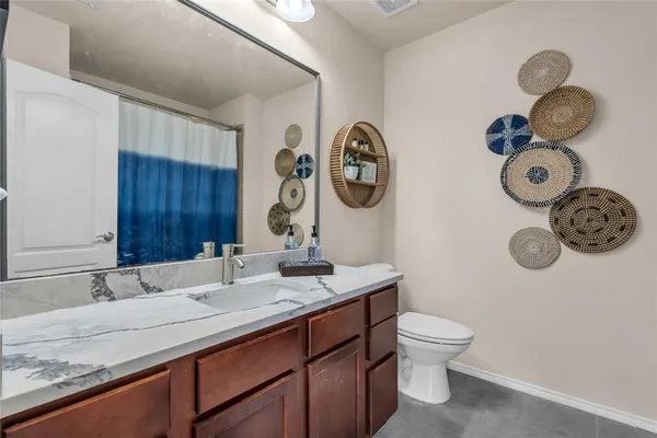 a bathroom with a toilet and a sink