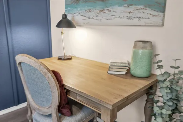 a dining room with table and chairs