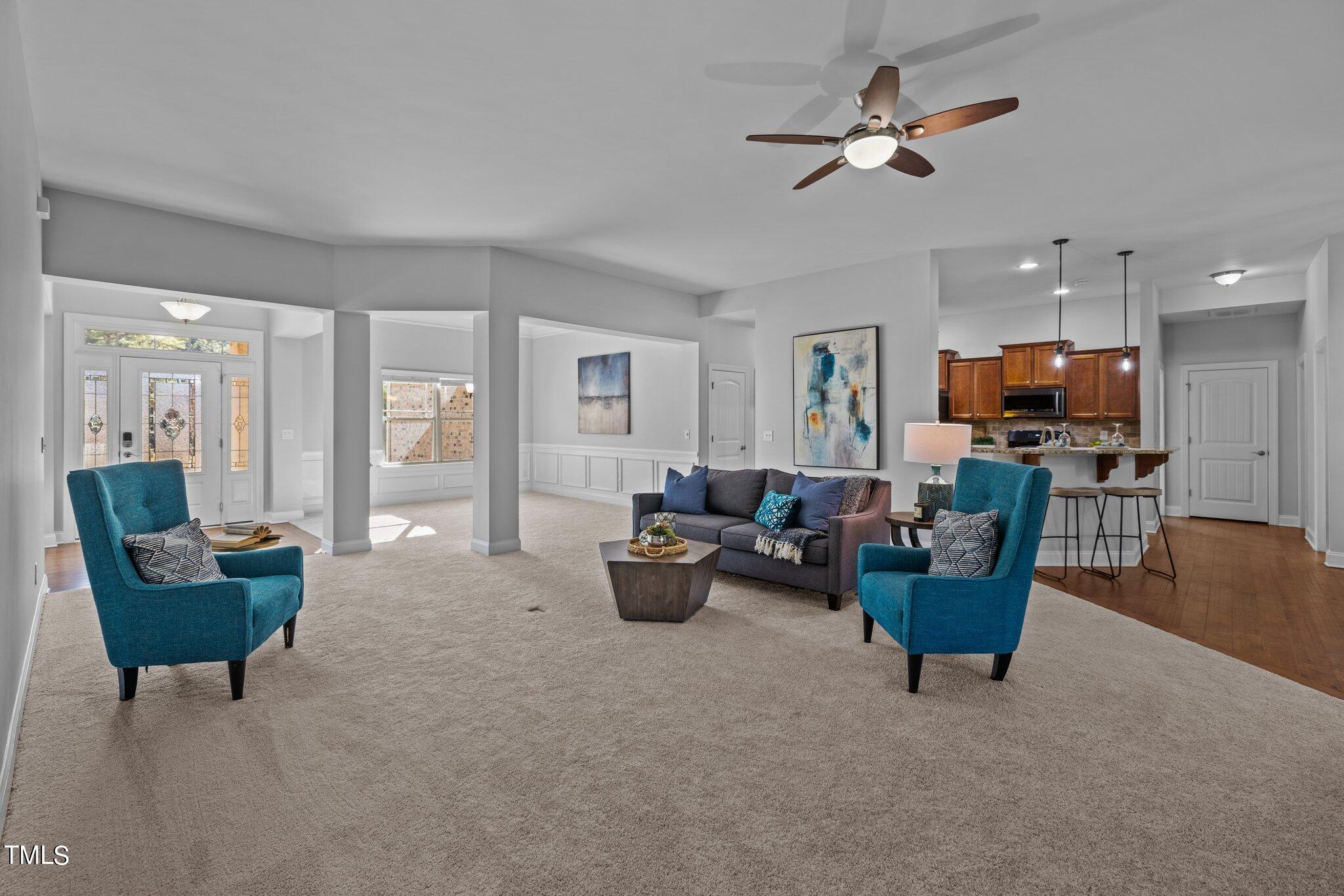 95 Windy Creek Drive Willow Spring, NC 27592 - Photo 11 of 55 a living room with furniture and a view of kitchen