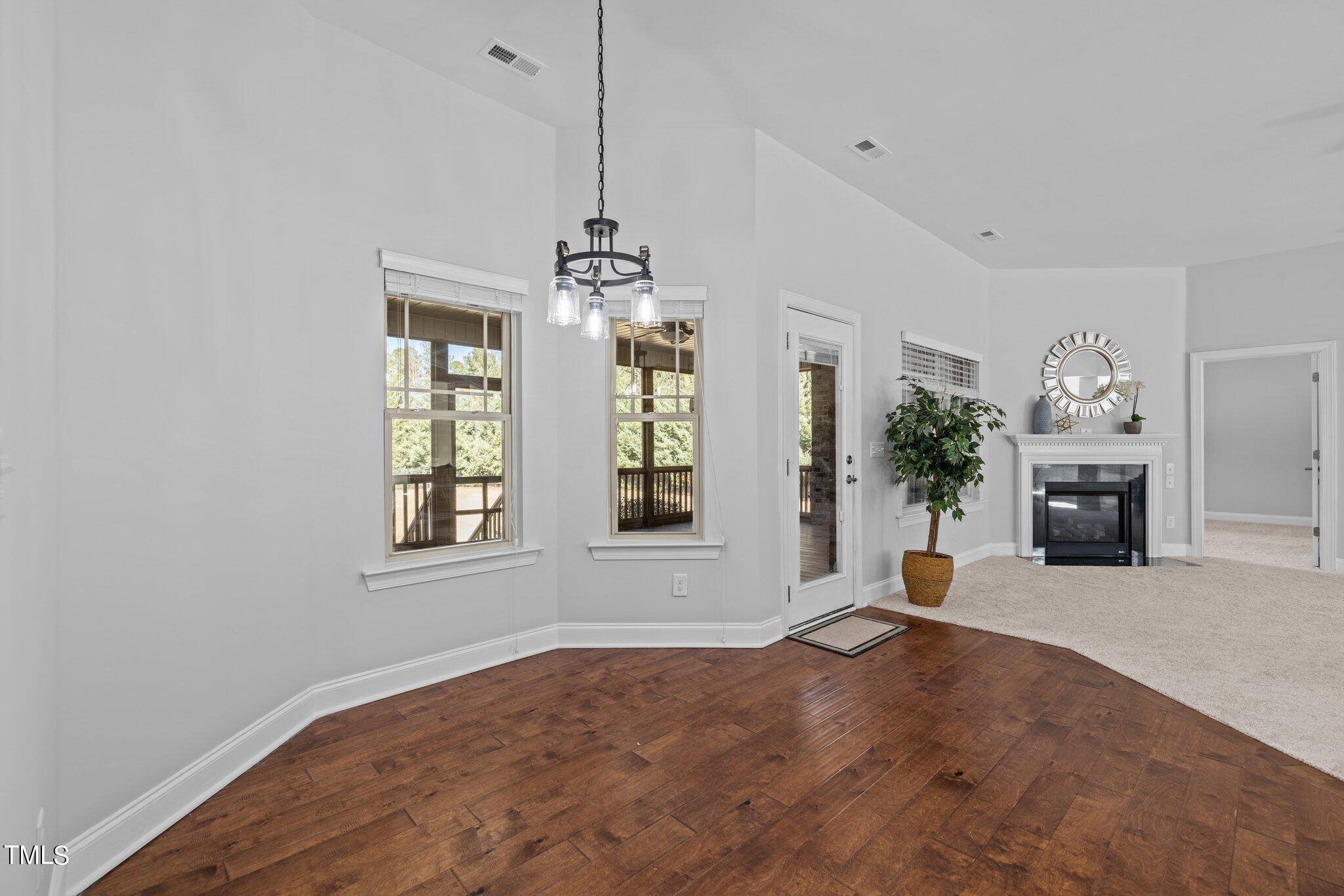95 Windy Creek Drive Willow Spring, NC 27592 - Photo 15 of 55 a view of an empty room with a window