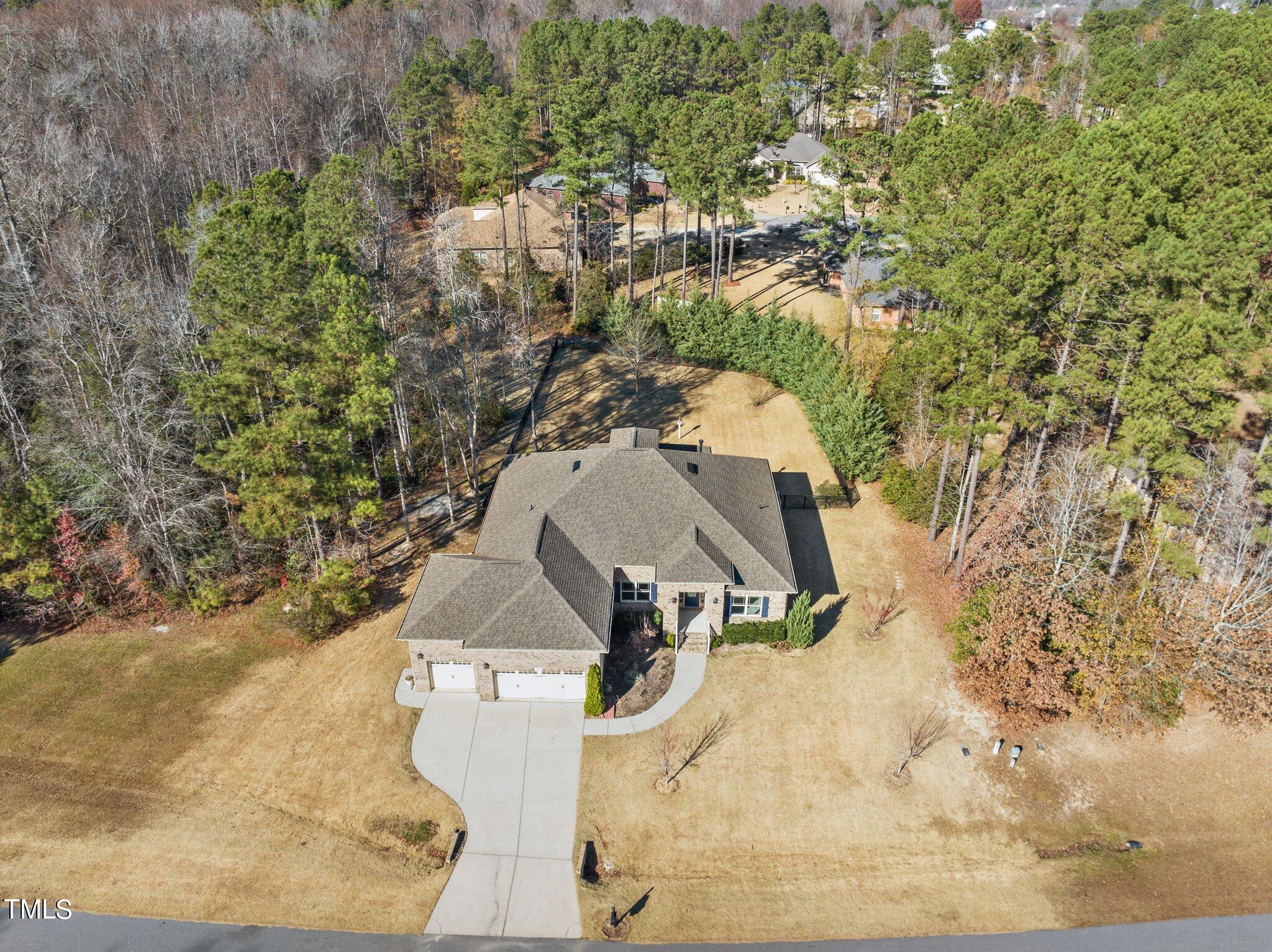 95 Windy Creek Drive Willow Spring, NC 27592 - Photo 2 of 55 an aerial view of a house with a yard