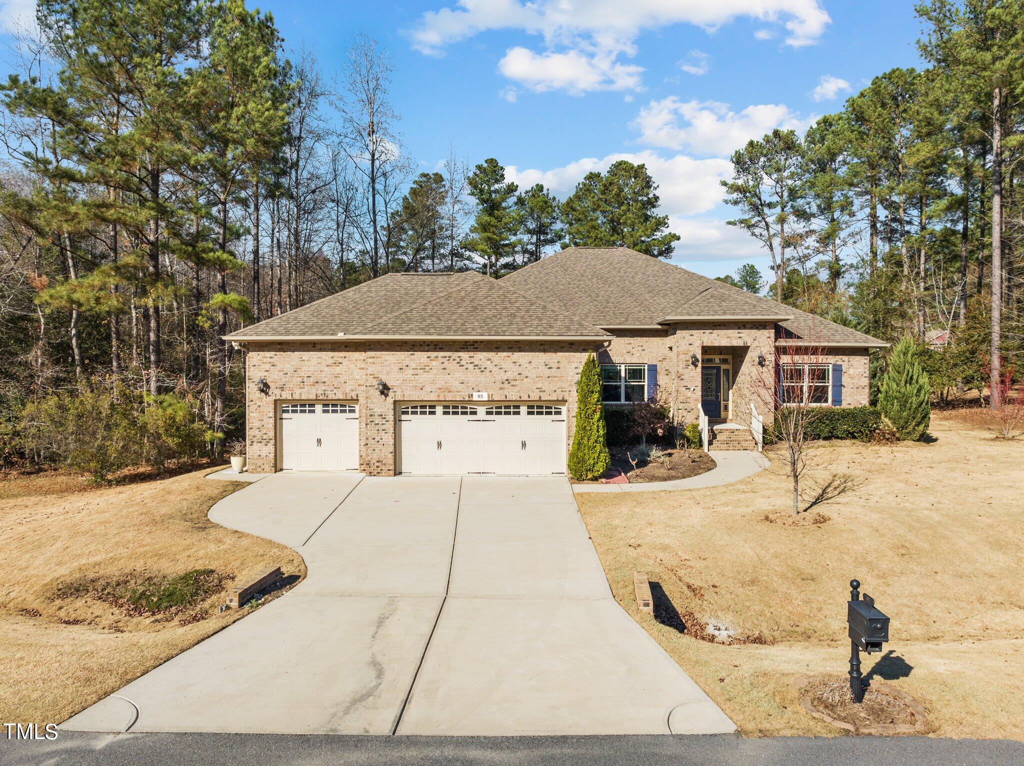 95 Windy Creek Drive Willow Spring, NC 27592 - Photo 33 of 55 a view of house with yard and trees