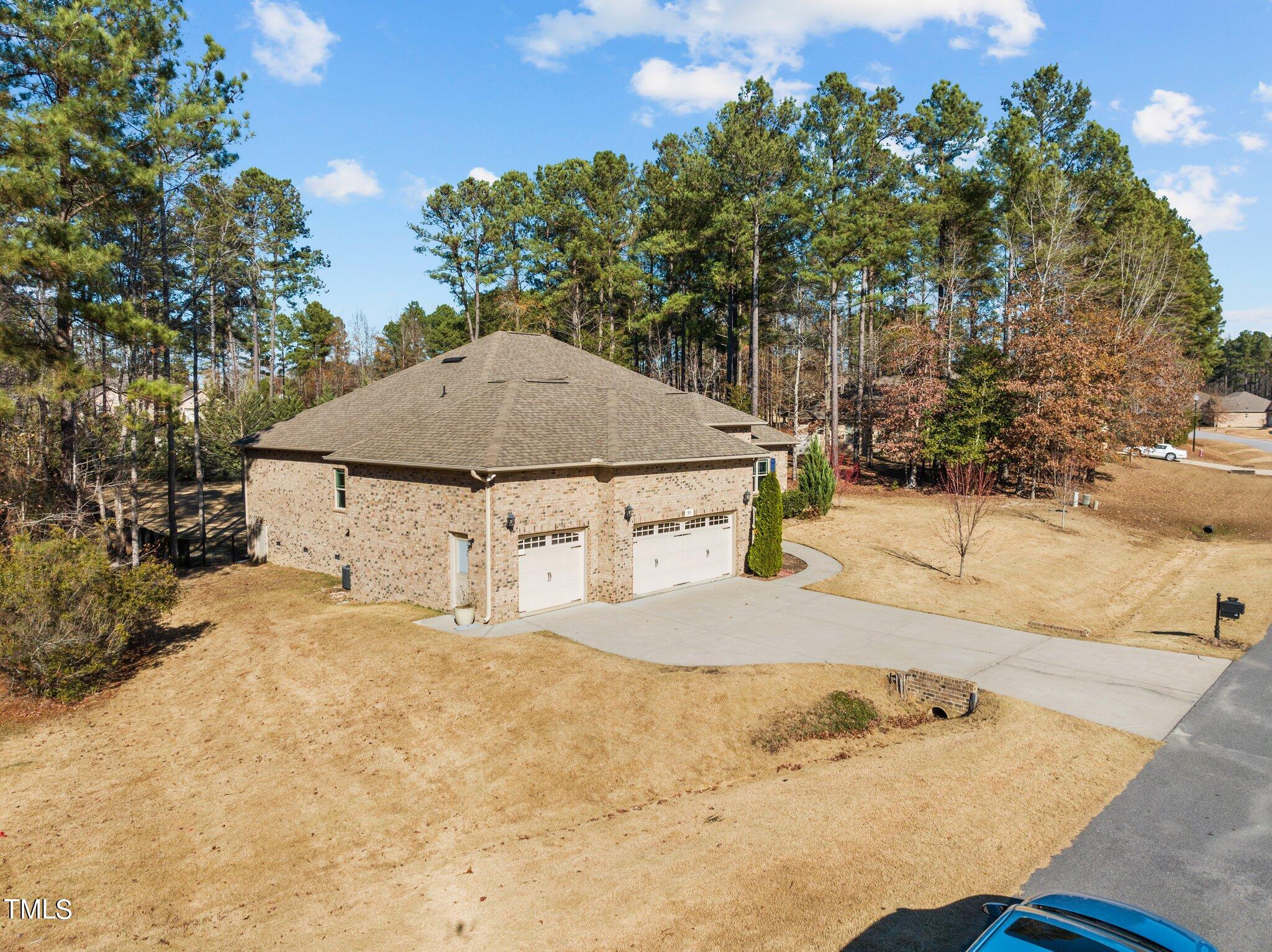 95 Windy Creek Drive Willow Spring, NC 27592 - Photo 36 of 55 a view of a house with snow on the road