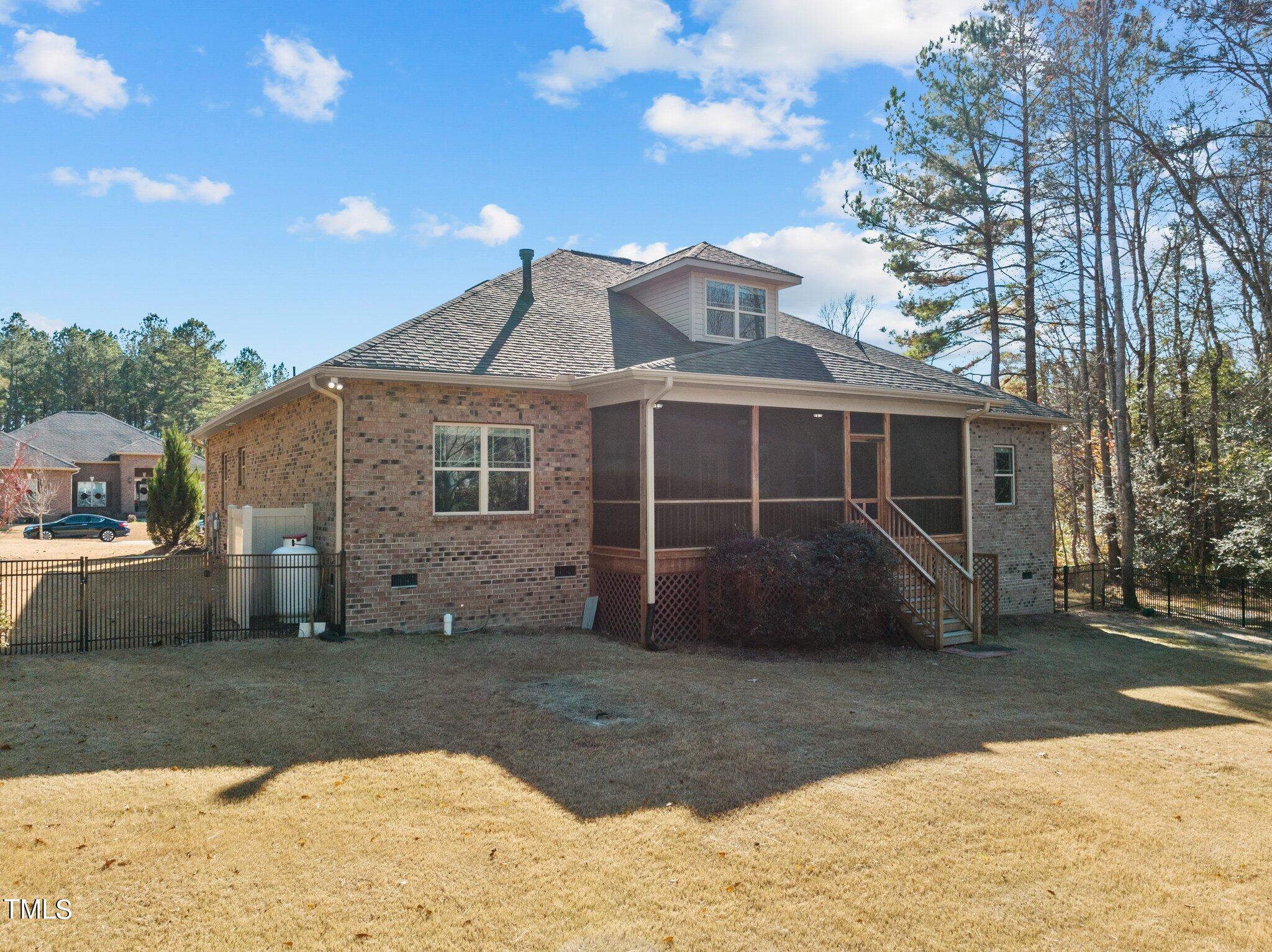 95 Windy Creek Drive Willow Spring, NC 27592 - Photo 38 of 55 a front view of a house with a yard and garage