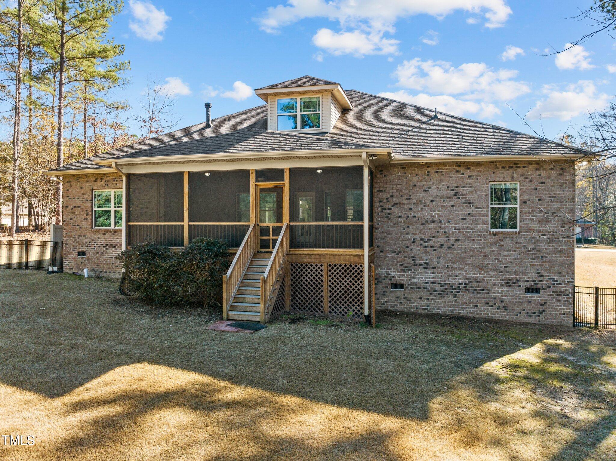 95 Windy Creek Drive Willow Spring, NC 27592 - Photo 41 of 55 a front view of a house with garden