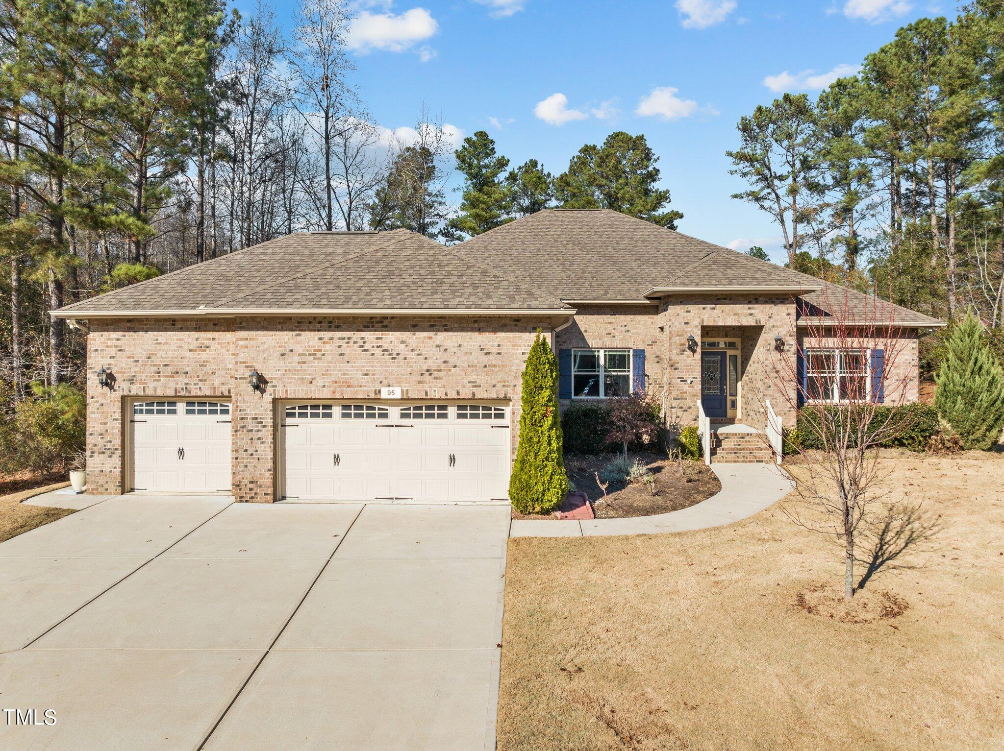 95 Windy Creek Drive Willow Spring, NC 27592 - Photo 52 of 55 a view of a house with backyard