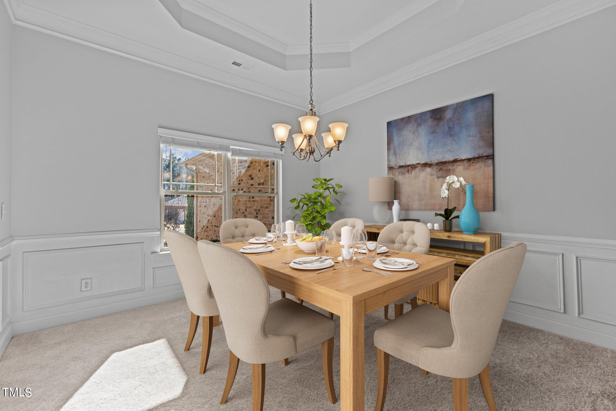 95 Windy Creek Drive Willow Spring, NC 27592 - Photo 7 of 55 a dining room with furniture a potted plant and a chandelier
