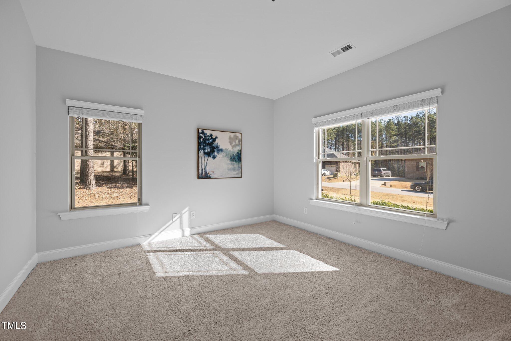 95 Windy Creek Drive Willow Spring, NC 27592 - Photo 8 of 55 a view of an empty room with a window