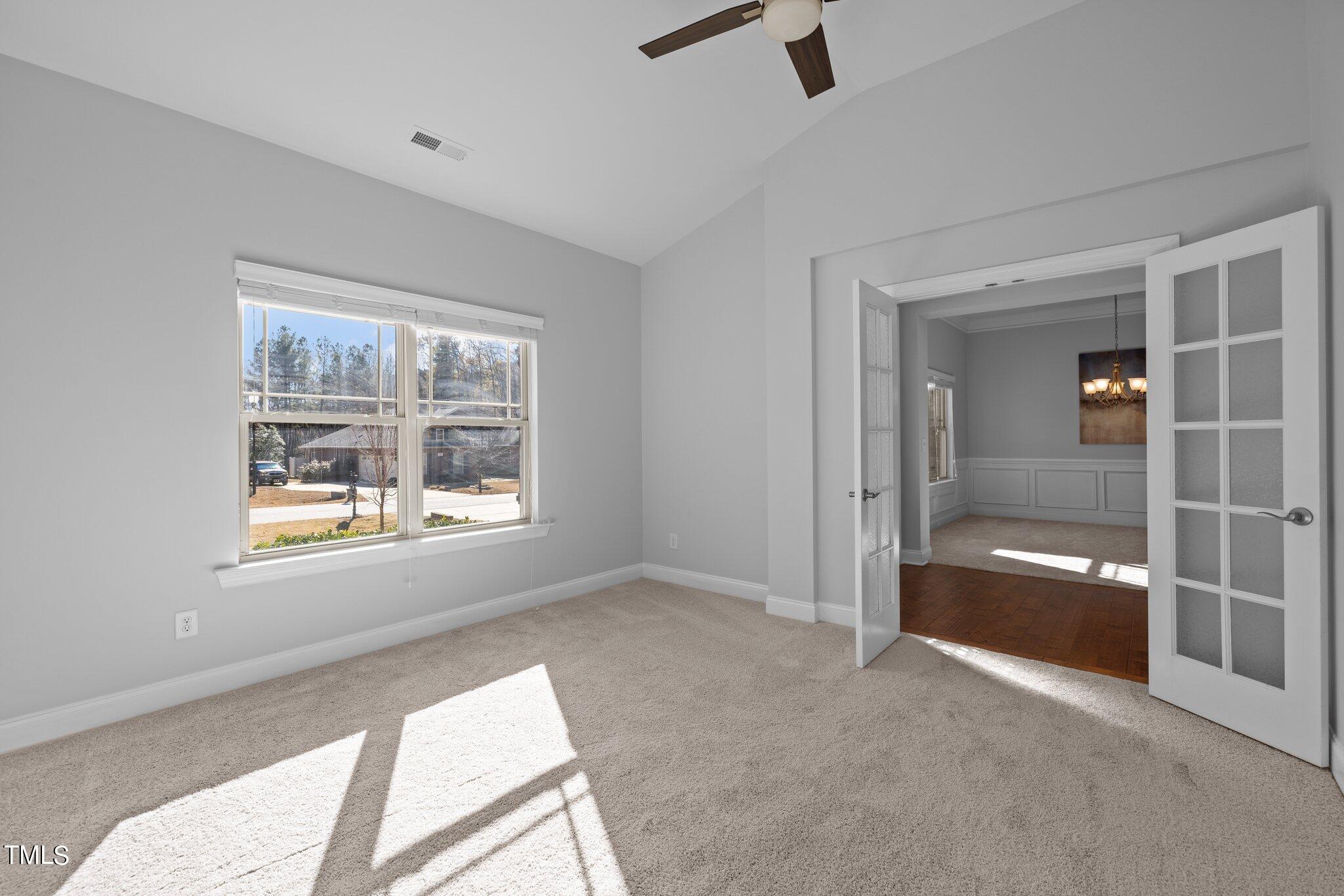95 Windy Creek Drive Willow Spring, NC 27592 - Photo 9 of 55 a view of an empty room with a window