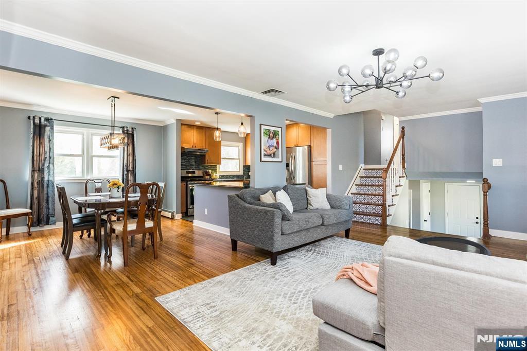 179 Grove Avenue Verona, NJ 07044 - Photo 13 of 34 a living room with fireplace furniture and a wooden floor