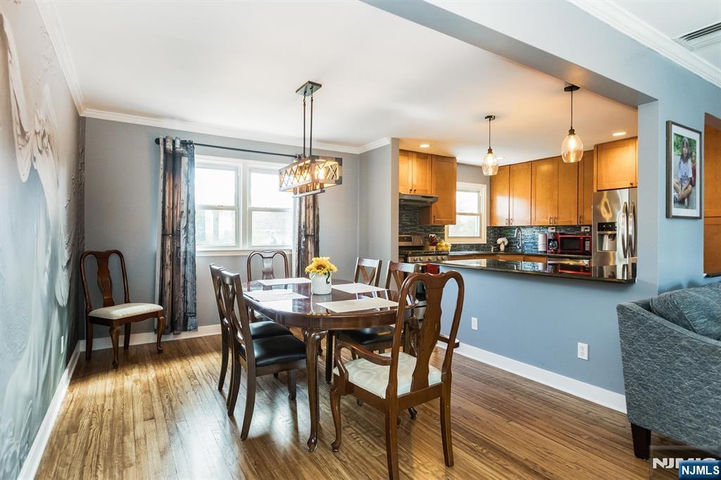 179 Grove Avenue Verona, NJ 07044 - Photo 14 of 34 a view of a dining room with furniture window and wooden floor