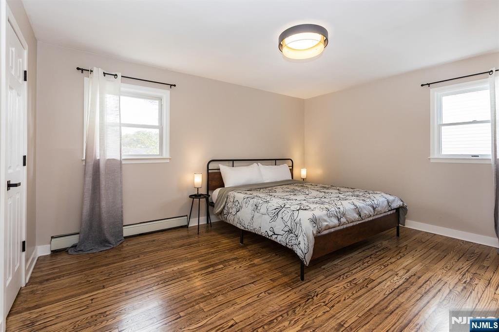 179 Grove Avenue Verona, NJ 07044 - Photo 21 of 34 a bedroom with a bed and a window