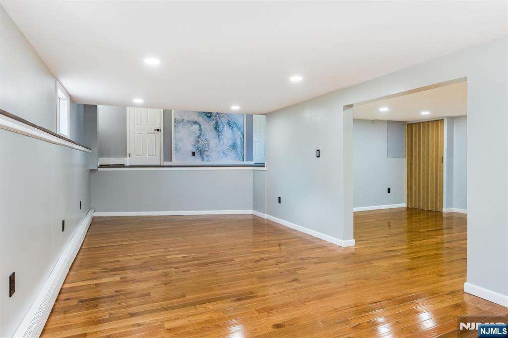 179 Grove Avenue Verona, NJ 07044 - Photo 27 of 34 a view of a kitchen with wooden floor and a ceiling fan
