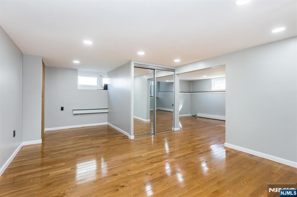179 Grove Avenue Verona, NJ 07044 - Photo 29 of 34 a view of empty room with wooden floor