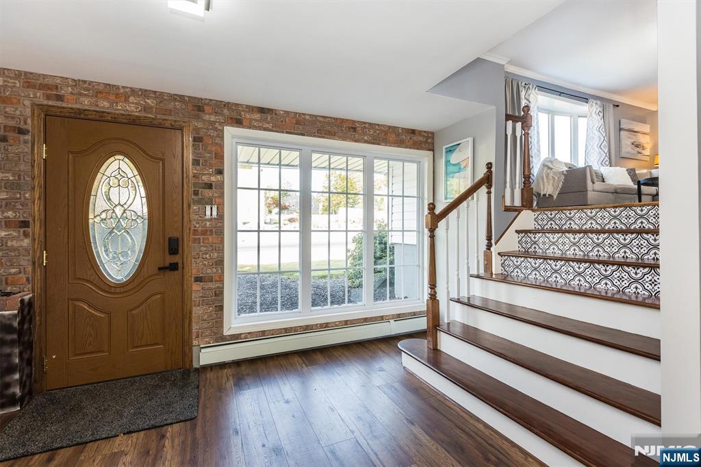 179 Grove Avenue Verona, NJ 07044 - Photo 5 of 34 a view of entryway with wooden floor