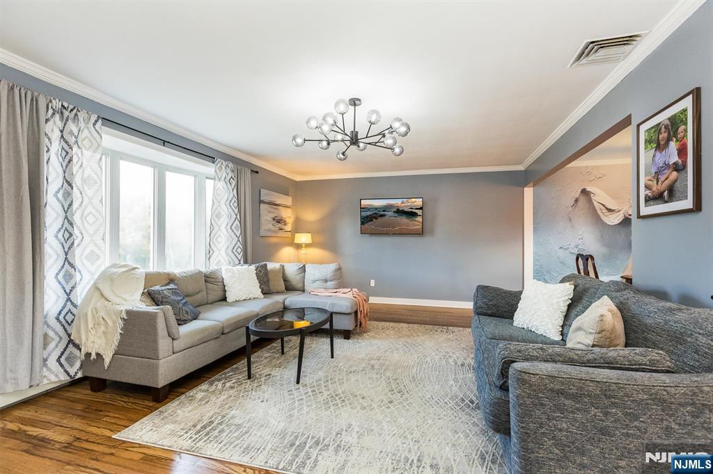 179 Grove Avenue Verona, NJ 07044 - Photo 9 of 34 a living room with furniture and a large window