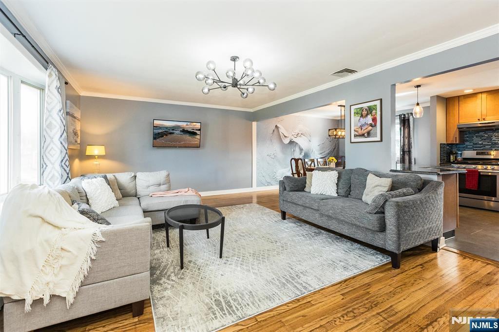 179 Grove Avenue Verona, NJ 07044 - Photo 10 of 34 a living room with furniture and a flat screen tv