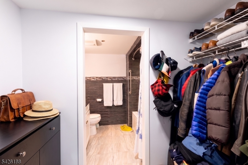 4 Millay Court Teaneck, NJ 07666 - Photo 14 of 32 a view of walk in closet with clothes and shoes