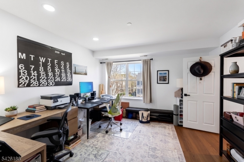 4 Millay Court Teaneck, NJ 07666 - Photo 20 of 32 a room with furniture a rug and a window