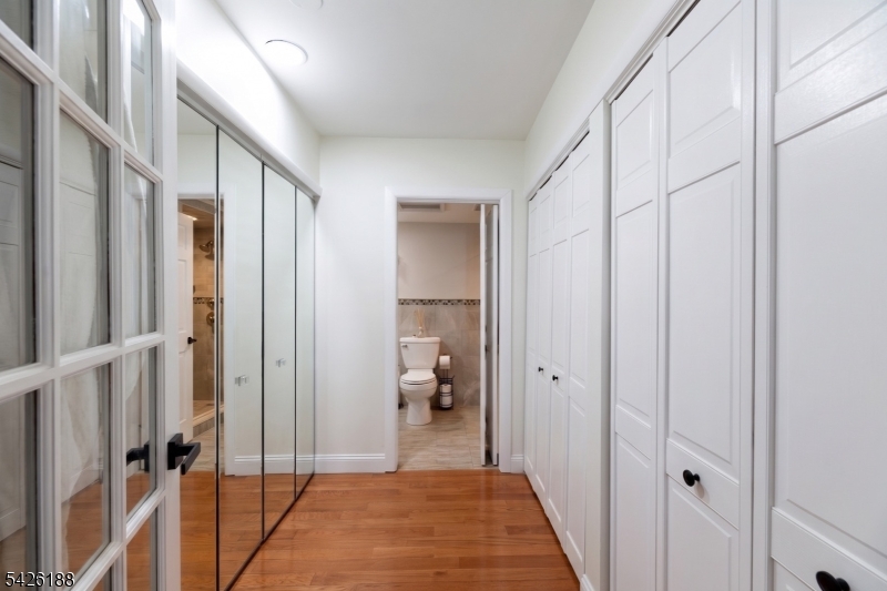 4 Millay Court Teaneck, NJ 07666 - Photo 29 of 32 a view of a hallway with a livingroom and furniture