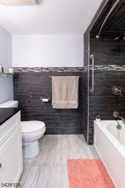4 Millay Court Teaneck, NJ 07666 - Photo 30 of 32 a bathroom with a toilet and a bathtub