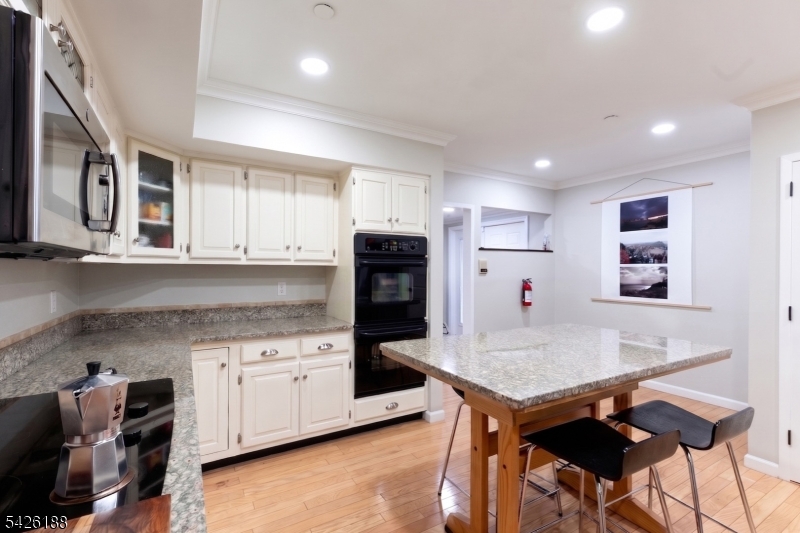 4 Millay Court Teaneck, NJ 07666 - Photo 31 of 32 a kitchen with stainless steel appliances granite countertop a refrigerator and microwave