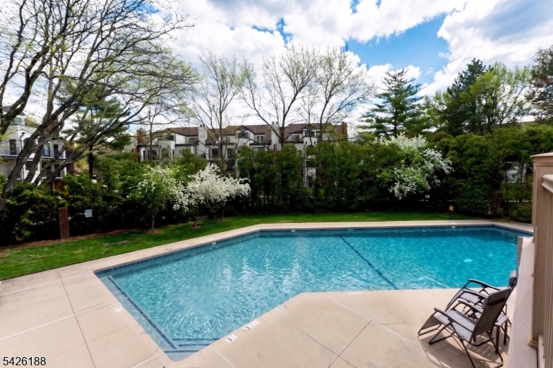 4 Millay Court Teaneck, NJ 07666 - Photo 5 of 32 a view of a swimming pool with a yard